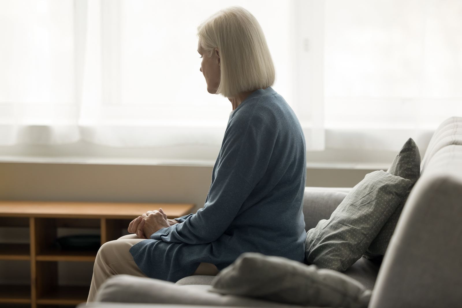 Senior woman seated by a window, reflecting the mobility and comfort osteopathy supports with age. Senior woman seated by a window, reflecting the mobility and comfort osteopathy supports with age.