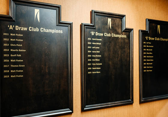 Championship boards with the names of previous winners, on the wall at the Toronto Athletic Club